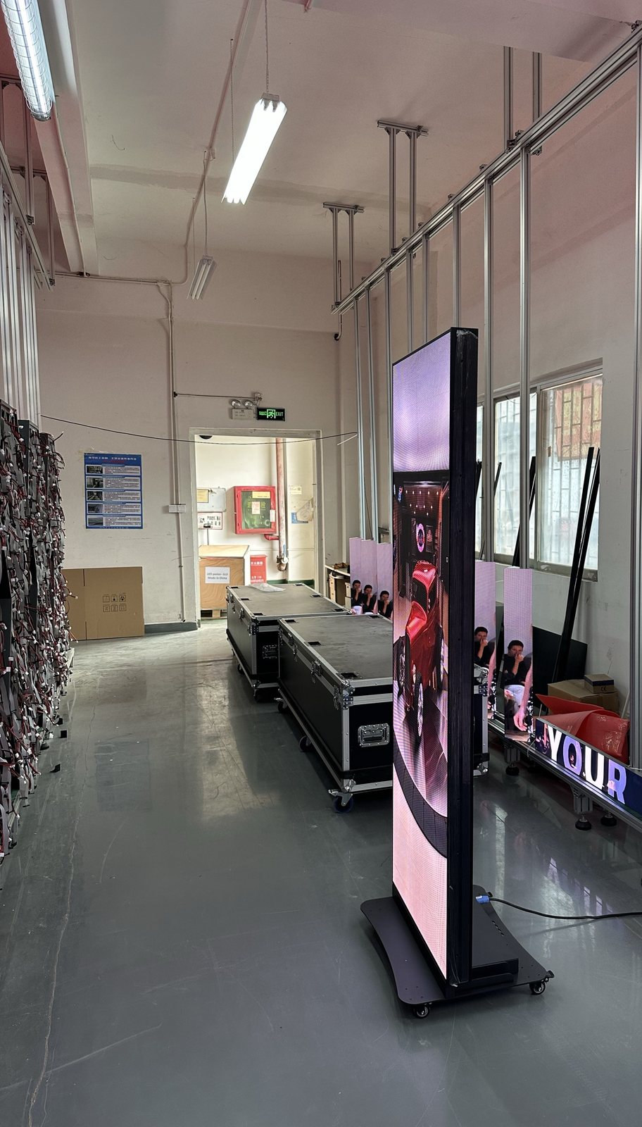 Double-sided poster seen from one side with the second face visible at an angle