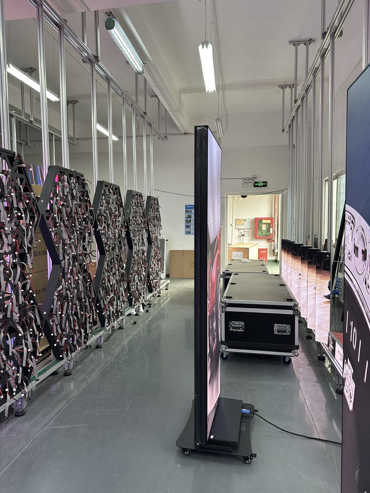 LED posters being assembled at a workbench