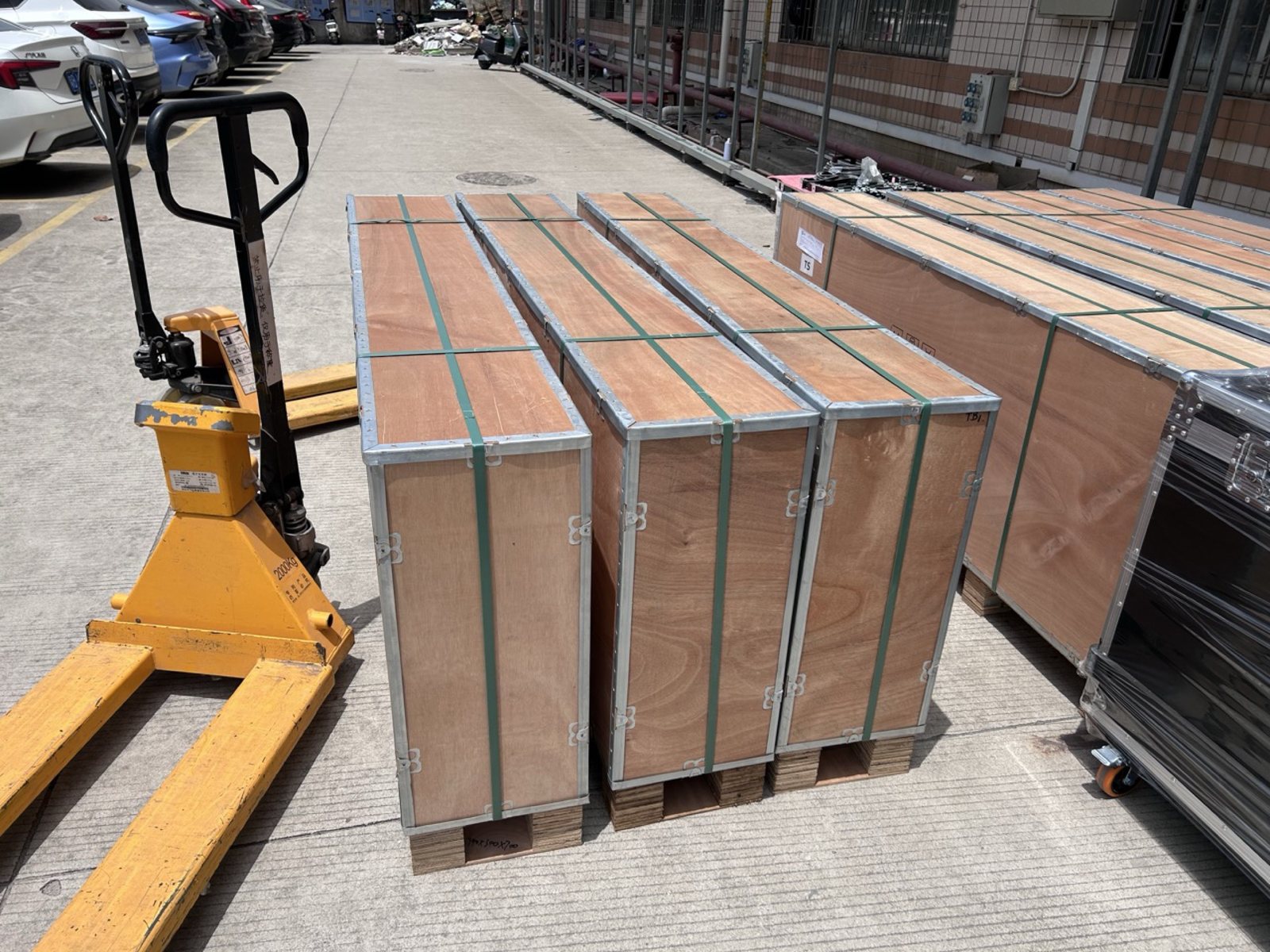 Flight case with a poster being loaded onto a pallet at the factory