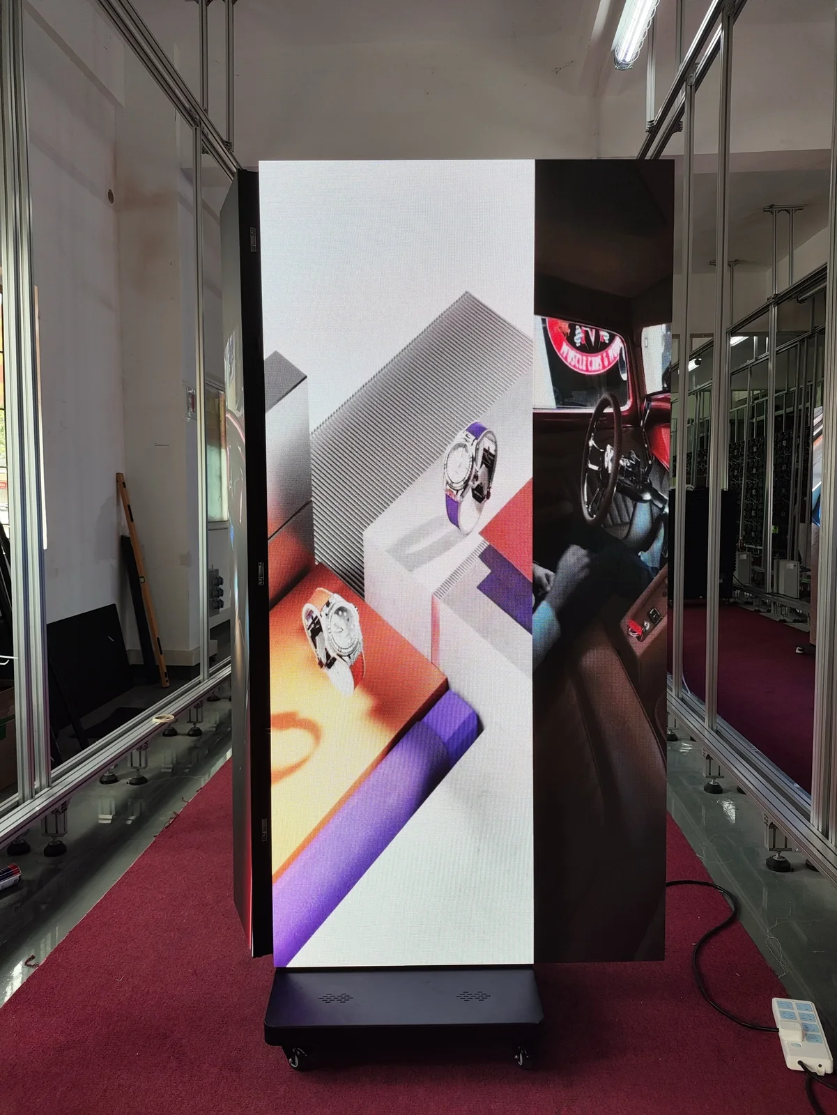 Indoor tri-fold LED poster lit in the workshop during testing